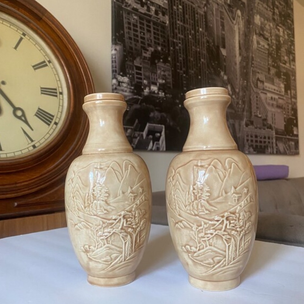 Pair of beige ceramic 9” chinoiserie vases with raised nature scene